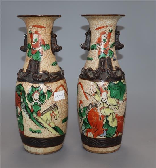 A pair of Chinese crackle glaze warrior vases, Guangxu period (1875-1908) height 25cm